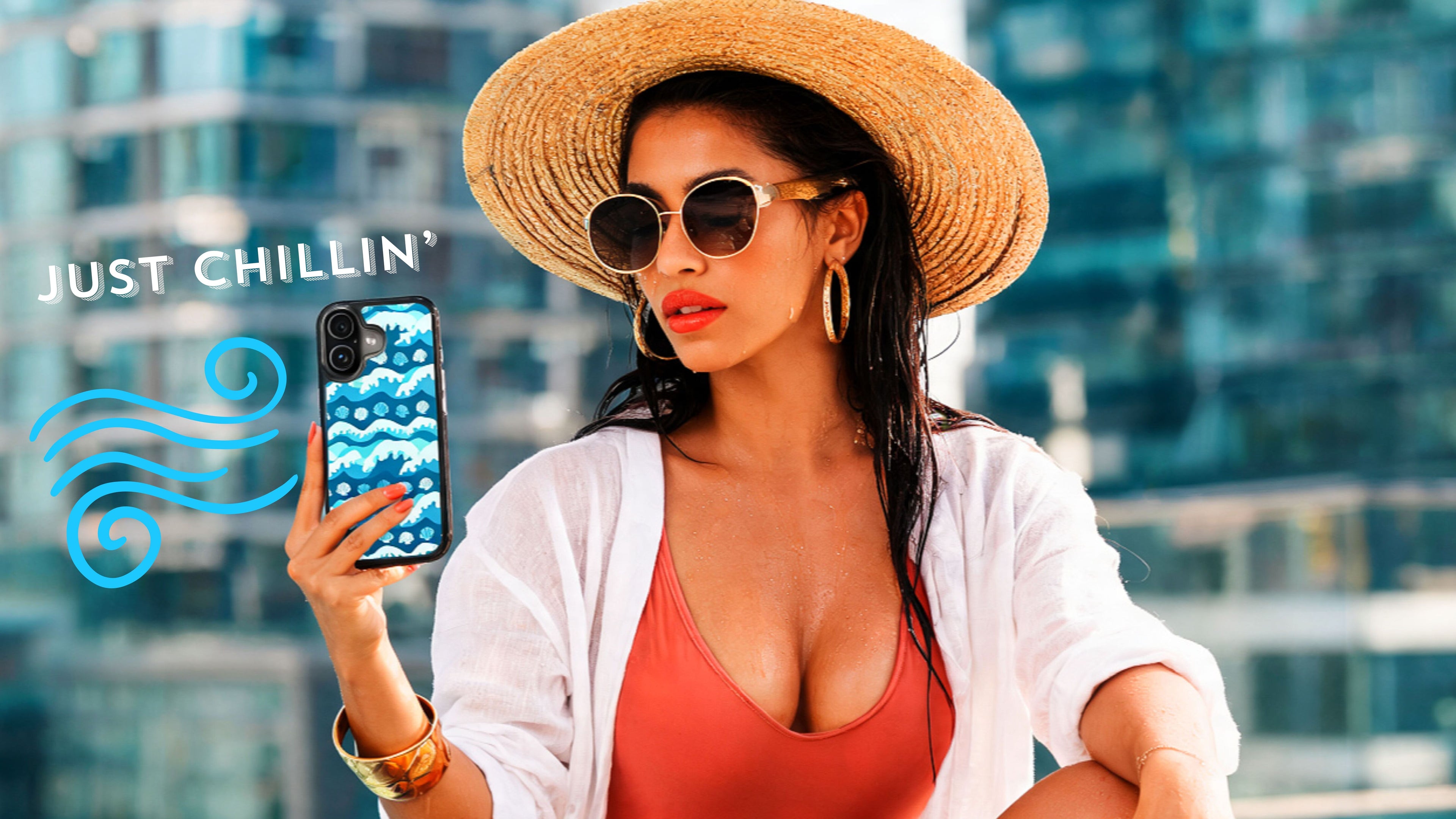 A woman in a straw hat, white cardigan, and coral swimsuit takes a selfie by a pool, holding a phone with a blue patterned case. The text 'JUST CHILLIN'' appears on the left.